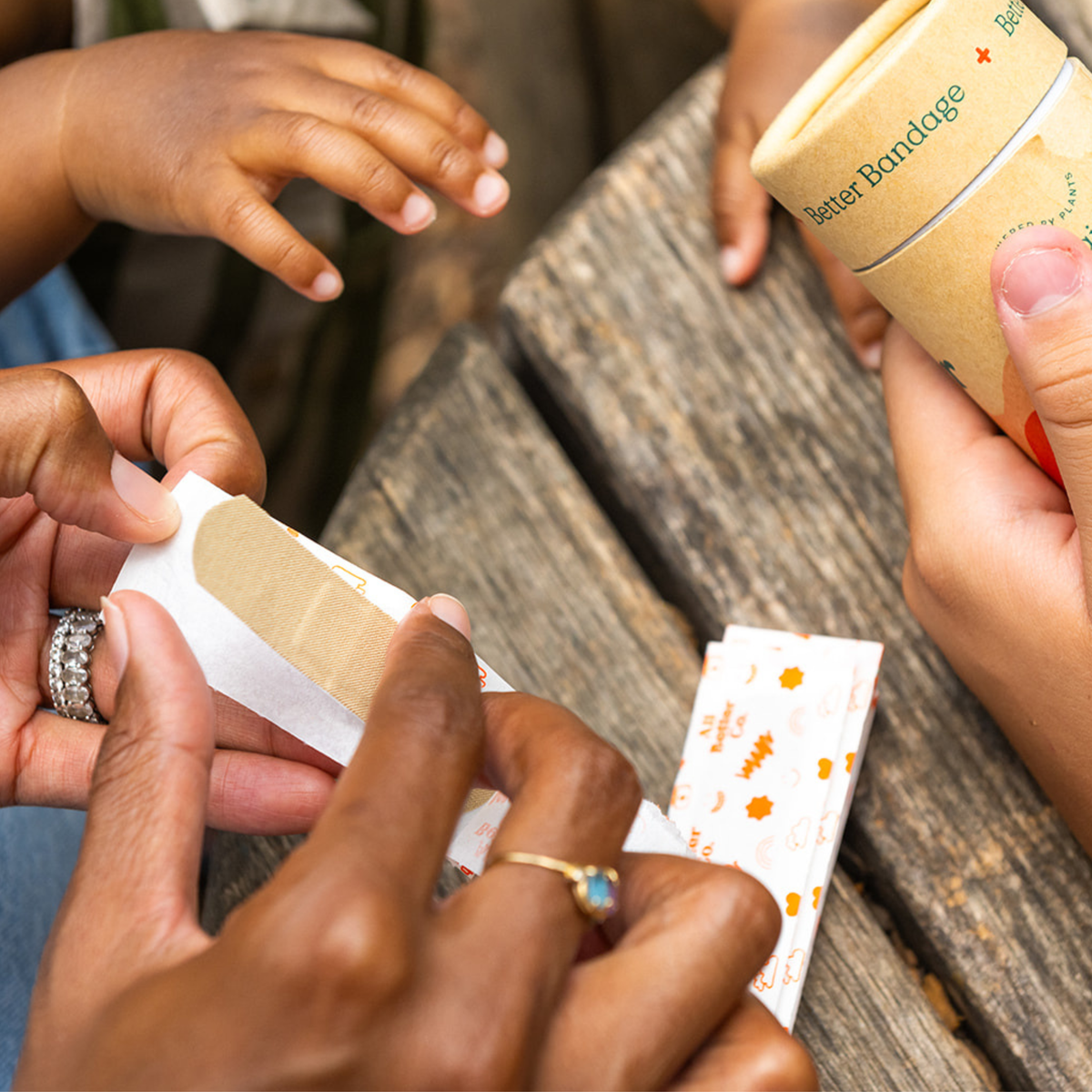 hands holding the better bandages 