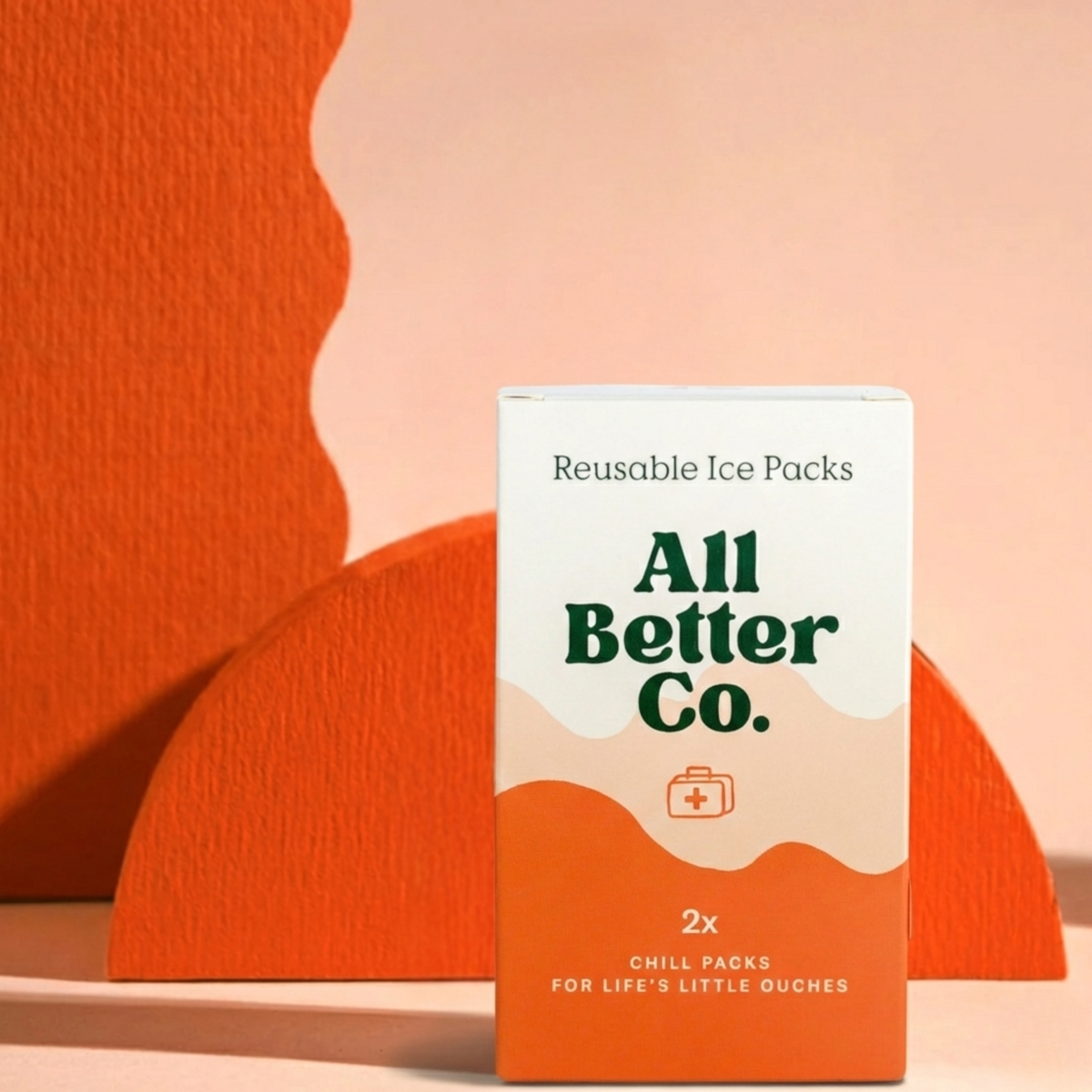Box of All Better Co. reusable ice packs on a peach background
