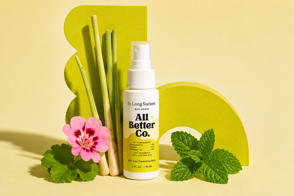 All Better Co. hair spray bottle with natural elements on a yellow background