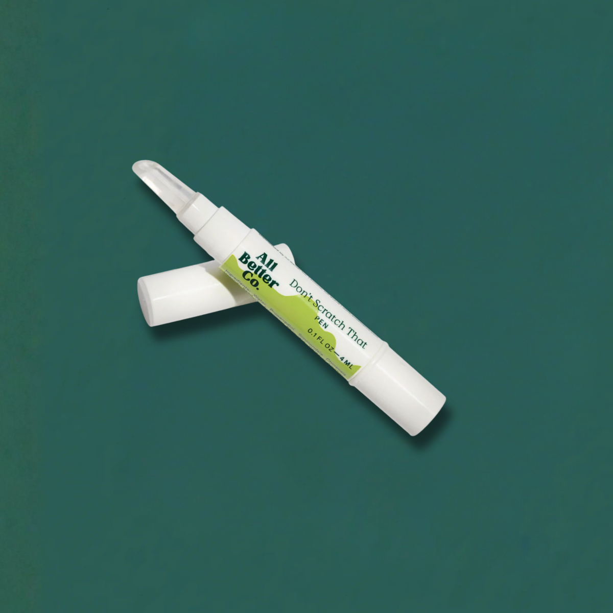 Two white pens with green labels on a teal background